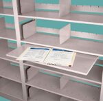 The Aurora Quik-Lok Shelving Reference Shelf, Legal Size, features a metal design with adjustable dividers. Its teal-colored central shelf comfortably holds legal-size documents and two sheets of paper with charts and text.