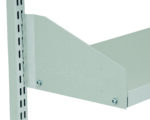 Close-up of a metal shelf bracket attached to a slotted metal upright, designed for supporting a shelf. The bracket is angled and secured with screws, showcasing a simple and sturdy design in a light gray color.