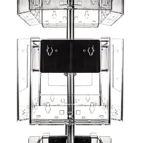 The Vulcan CIRC 12 CLEAR shelving units boast a transparent, cubed design around a metal pole with 11 POCK 3 ROTATORS, offering a geometric and symmetrical appearance. The clear material enhances visibility, emphasizing its industrial and modern style.