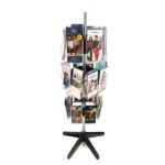 The Vulcan STAR 12 CLEAR 11 POCK 3 ROTATORS is a tall stand elegantly holding brochures and pamphlets. With multiple pockets on its central pole, it showcases vibrant images and text, while its black base with four supportive legs provides stability and organization.