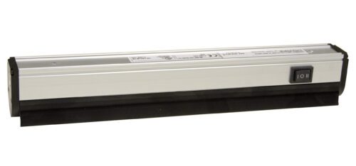 A silver and black, rectangular electronic device with a power switch on one side. The device appears to be a strip machine tool with indicator labels on the top surface.