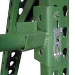 Close-up view of a green industrial metal beam structure with perforations and a connecting joint.