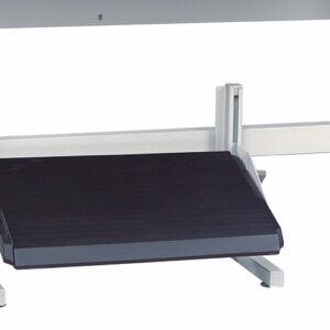 A metal footrest with a black, textured, rectangular surface adjustable by a lever is placed under a desk. The footrest is designed to support foot placement and improve ergonomic posture while seated.