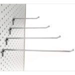 The Vulcan SP HOOK 4 MEDIUM W/BALL 10PK metal hooks are attached to a white pegboard with evenly spaced holes. Arranged in a staggered pattern, the hooks extend outward horizontally at various heights against a plain, light background.