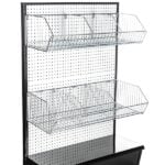 The Vulcan Wire Basket Display Rack includes a sleek black pegboard stand with two shelves for organizing merchandise in 12 x 24 metal wire baskets (Vulcan WIRE BASKET 12 X 24 OEB, 8 per carton), featuring a solid black panel base for stability and style in any retail setting.