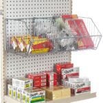 A store shelf displays office supplies featuring Vulcan WIRE BASKET 12 X 24 OEB baskets with boxes of rubber bands and other items, while the lower shelf holds packs of sticky notes, Sharpies, and index cards. Packaging is vibrant, with distinct brand names clearly visible.