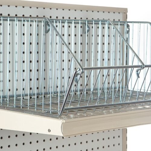 A Vulcan WIRE 12 OEB DIVIDE from a carton of 10 is stylishly displayed on a pegboard shelf. Crafted with sleek metal rods, it provides visibility and ventilation for items. The adjustable pegboard ensures versatile storage solutions.