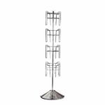The Vulcan CIRC 16 3/4 POCK 4 ROTATORS is a vertical metal rack with four evenly spaced tiers and a sleek design, crafted with shiny precision. Its stable round base ensures balance and makes it ideal for efficiently showcasing circular items.