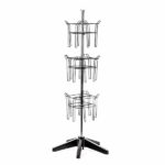 The Vulcan STAR magazine rack has three circular tiers in its 12 3/4 POCK design, each holding multiple items. It features a sturdy five-leg base and vertical pole support with 3 ROTATORS for added functionality in a minimalist industrial style.