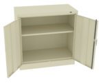A beige metal cabinet with two open doors revealing two empty shelves inside. The cabinet is set against a plain white background.