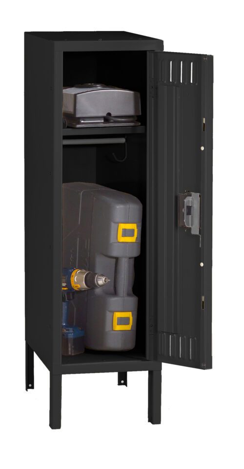A black metal storage locker with one door open, revealing various items inside. On the top shelf is a stack of closed boxes. The bottom shelf holds a large gray toolbox with yellow accents and a power drill.