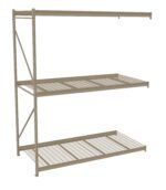A beige, metal shelving unit with three wire-mesh shelves, supported by sturdy vertical beams on each side. The design is industrial and suitable for heavy-duty storage.