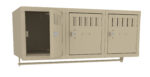 Three beige wall-mounted metal lockers, each with a small vent at the top. The left locker door is open, revealing an empty interior, while the two right lockers are closed. A horizontal bar runs across below them.