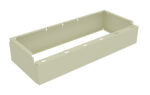 A beige, rectangular, open-top metal frame with notches along the top edges. The object appears to be a bracket or casing, likely used for holding or supporting a mechanical or electrical component.
