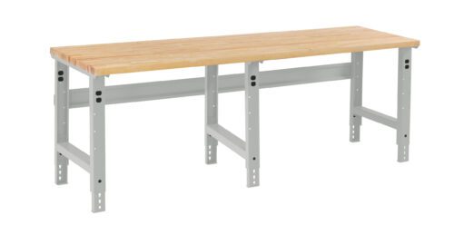 clukpvzcjursyqvzfqw9.jpg A sturdy workbench with a wooden top and adjustable gray metal legs. The bench has a simple design, suitable for various tasks, with a rectangular shape and visible support brackets beneath the tabletop.