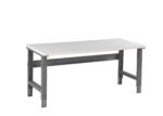 A simple, modern workbench with a flat white tabletop and sturdy gray metal legs. The table has an industrial design and adjustable height options, suitable for workshops or garages.