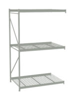A metal storage rack with three open shelves of different depths, designed for warehouse or industrial use. The structure is silver-gray and features a grid-like pattern on the bottom shelf and solid flat surfaces on the upper shelves.