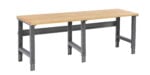 A wooden-topped workbench with a metal frame and four adjustable legs is shown. The bench features a simple, sturdy design suitable for workshops or garages. The wood surface contrasts with the gray metal support structure.