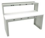 A light gray workbench with a white tabletop, featuring multiple power outlets on the front panel and a raised shelf above. The back and sides provide support and stability for the structure.