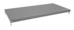 A rectangular, flat, gray metal shelf with small circular holes along the edges. It has metal brackets on each corner for mounting purposes. The surface is smooth, and the background is plain white.