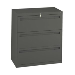 A gray, three-drawer filing cabinet with a lock at the top. The cabinet is square-shaped and appears to be made of metal. Each drawer has a handle for opening.