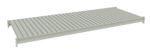 A rectangular metal shelf with a ribbed, slatted surface and a solid frame, designed for a shelving unit. The color is a muted grey, and the shelf has mounting brackets at each corner for installation.