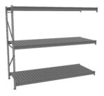 A gray, three-tier metal shelving unit with horizontal slats and an open frame. The shelves are evenly spaced and supported by vertical beams on the left side. The structure is minimalistic and industrial in design.