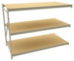 Warehouse-style shelving unit with three large, empty beige shelves. The frame is metallic with support bars on the sides. The shelves appear sturdy and spacious, suitable for heavy-duty storage.