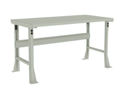 f9fh7tbeulueqjfaluuy.jpg A light gray industrial workbench with a flat rectangular surface and sturdy legs. The bench has a support beam underneath for stability and appears to be made of metal. The design is simple and functional, suitable for various work environments.