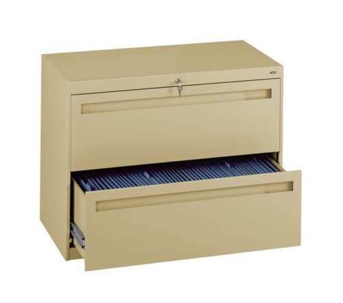 A beige metal file cabinet with two drawers. The top drawer is closed and locked, while the bottom drawer is open, revealing blue files inside.