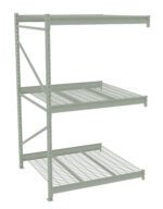 Industrial metal storage rack with three grated shelves, supported by vertical beams on each side. The design features a gray finish and open grid shelving, suitable for warehouse or garage organization.