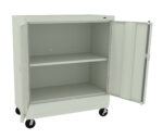 A light gray metal cabinet on wheels with its double doors open, revealing two shelves inside. The cabinet is empty, and the wheels allow for easy movement.