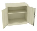 Open beige metal cabinet with double doors and two interior shelves. The doors are wide open, revealing empty shelves. The cabinet has a simple, industrial design.