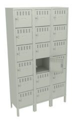 A light gray metal locker unit with three columns and five rows, featuring individual compartments. One compartment door is open, revealing an empty space inside. The lockers have ventilation slots and key locks.