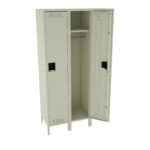 Two beige metal lockers with vertical vents on the doors. One locker door is slightly open, revealing an interior shelf and hanging bar. The lockers stand on short legs. The simple design suggests use in a school or workplace setting.