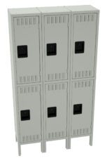 A row of six gray metal lockers arranged in two columns and three rows. Each locker has a black handle and ventilation slits. The lockers are mounted on short legs.