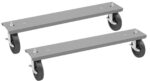 Two grey metal dolly bases with four black caster wheels each. The bases are rectangular with mounting holes at the edges. The caster wheels are attached at the corners, allowing for mobility and support of heavy items.