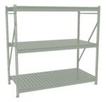 A sturdy, light green metal shelving unit with three spacious tiers. Each tier features evenly spaced metal slats. The frame includes vertical supports with holes for adjustable shelf placement. The unit is empty and stands against a white background.