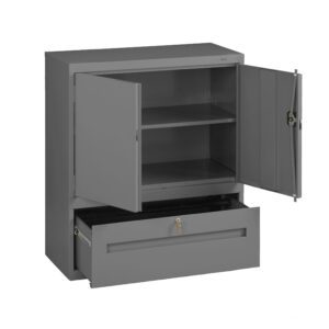 A gray metal storage cabinet with open doors revealing two shelves inside. Below the shelves is an open drawer with a lock, showing an empty compartment. The cabinet has a simple, industrial design.