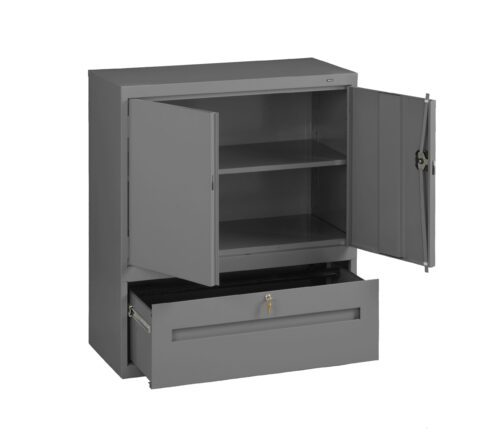 A gray metal storage cabinet with open doors revealing two shelves inside. Below the shelves is an open drawer with a lock, showing an empty compartment. The cabinet has a simple, industrial design.