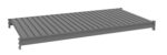 Image of a gray metal shelving unit viewed from above, showing a flat surface with parallel ridges. The shelf is supported by side brackets for mounting or stacking. The background is plain and white.