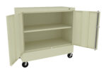 A beige metal storage cabinet on wheels with two open doors, revealing two internal shelves. The cabinet is simple and industrial in design, suitable for organizing tools or supplies.