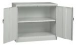 A metal storage cabinet with a plain design, featuring two doors opened outward. Inside, there are two adjustable shelves providing ample storage space. The cabinet is gray and has a minimalist, industrial appearance.