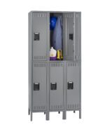 A gray metal locker unit with six compartments. Two upper compartments are open, revealing a blue hard hat, a blue jacket, and some bottles inside. The lower compartments remain closed.