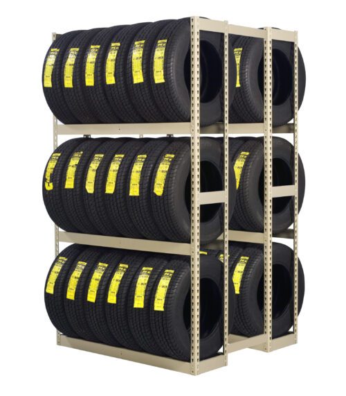 A shelf showcases rows of stacked tires, each boasting a bright yellow label. These tires are arranged neatly on a metal rack with three levels, maximizing storage efficiency and creating a grid of identical black tires with visible treads.