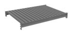 A gray, rectangular metal platform with evenly spaced horizontal slats. It has interlocking connectors on the sides and corners, suggesting modular assembly. The platform is elevated on short supports at each corner.