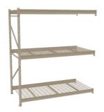 A beige metal shelving unit with three wire mesh shelves. The shelving structure is open on all sides and is designed for storage. It has a simple, industrial design and is set against a plain white background.
