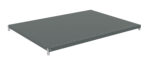 A flat, rectangular metal shelf viewed from an angle, featuring small holes along the edges. The shelf is supported by four corner brackets. The surface is smooth and gray, suggesting it is part of an industrial shelving unit.