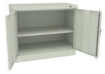 A large metal storage cabinet is open, revealing two shelves inside. The cabinet is light gray and both doors are fully open, showing the spacious interior suitable for storage.