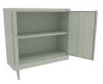 Open metal cabinet with two shelves and double doors slightly ajar. The cabinet is light gray, with a smooth surface and a simple design. The shelves appear adjustable, with visible peg holes along the sides.